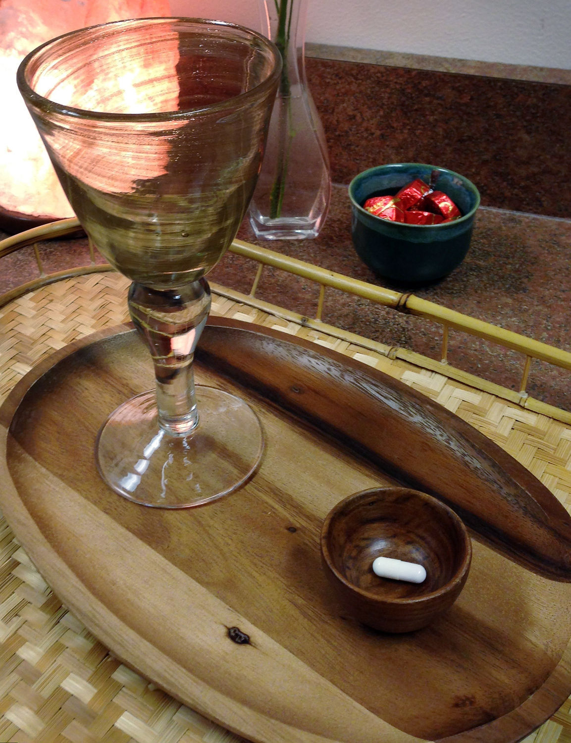Psilocybin pill in dish with glass